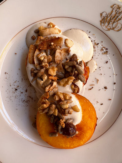 Roasted Peaches with Vanilla Cashew cream & crunchy nuts